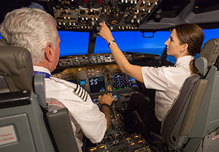 pilot and copilot in cockpit